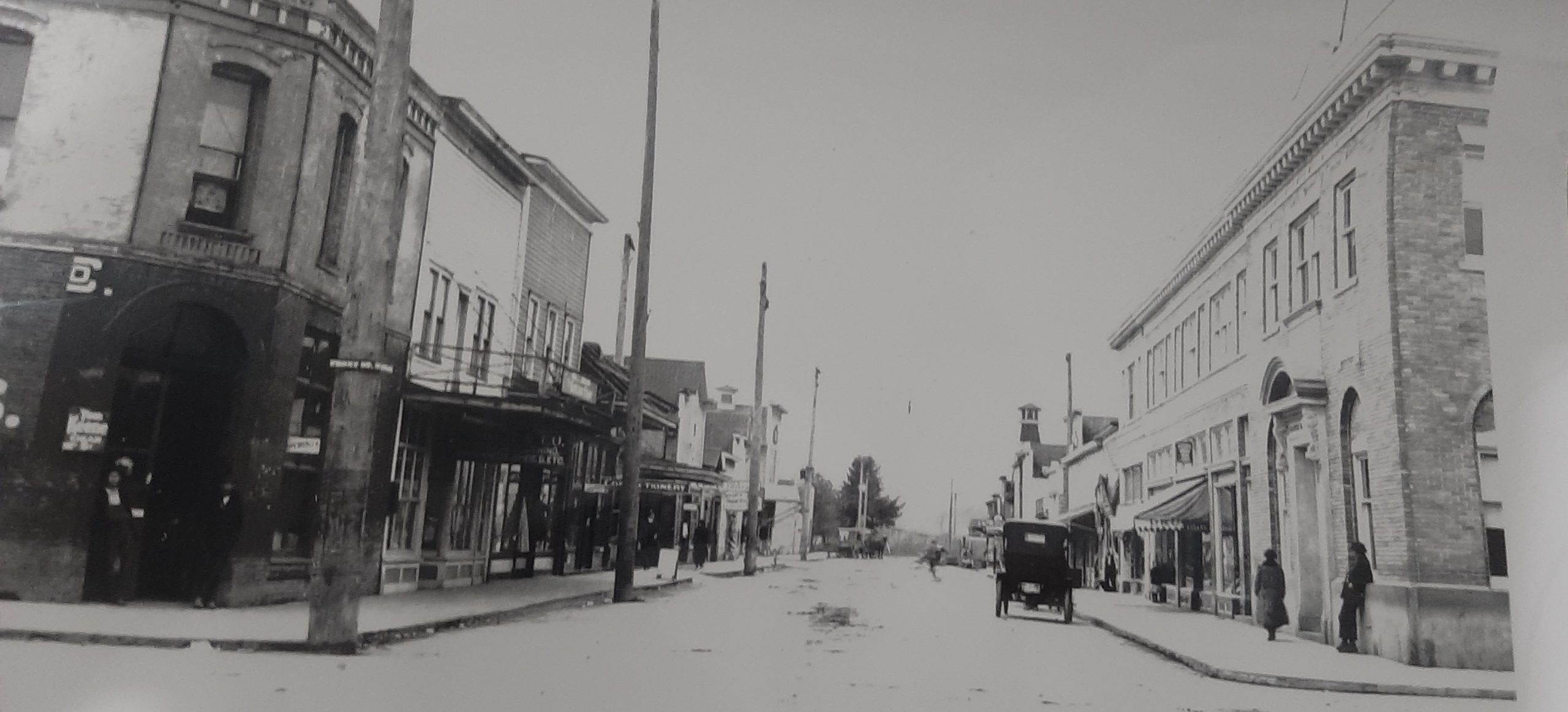 A historic photo of Cowlitz Street with the Vault building on the right side.